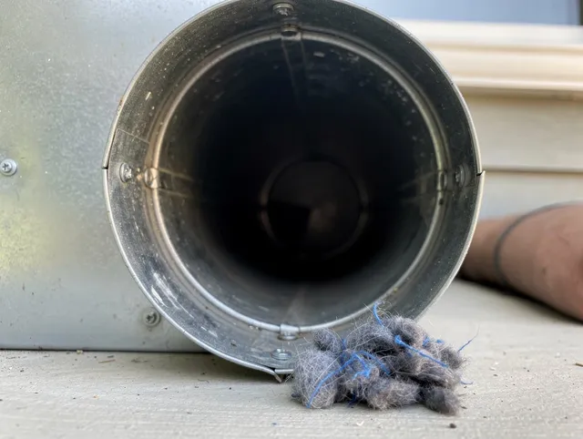 Killingly Dryer Vent Cleaning technician using specialized equipment to clear severe dryer vent blockage in Killingly